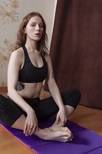 Cristy Red enjoys naked yoga on her mat